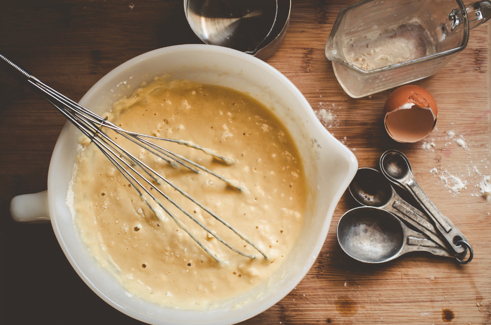 lumpy pancake batter on a board with ingredients